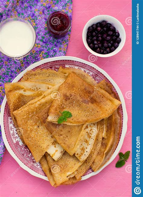 Sweet Thin Pancakes Crepes Served With Raspberry Jam Stock Photo