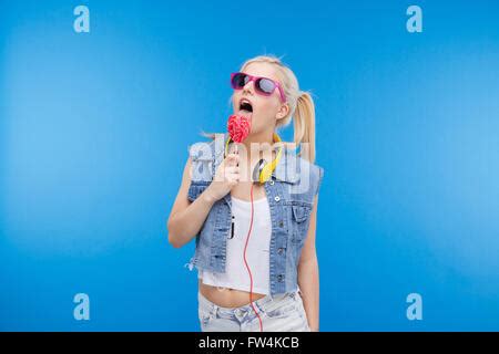 Woman Licking Lollipop Stock Photo Alamy