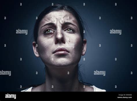 Close Up Portrait Of A Crying Woman With Bruised Skin And Black Eyes
