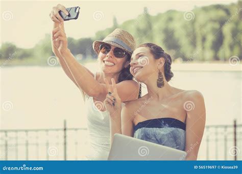 Two Beautiful Young Women Making Selfie Laughing Stock Image Image Of Cellular Carefree 56519697