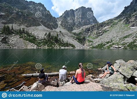 Young Hikers Enjoy Emerald Lake In Rocky Mountain National Park
