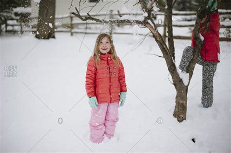 Young Girls Standing In The Snow Stock Photo Offset