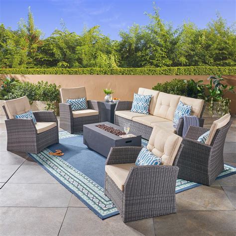 Fire pit set into the cast aluminum tabletop. Noble House Sanger Gray 7-Piece Wicker Patio Fire Pit ...