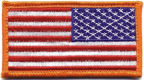 An Orange And White American Flag Patch With The Colors Of Red White