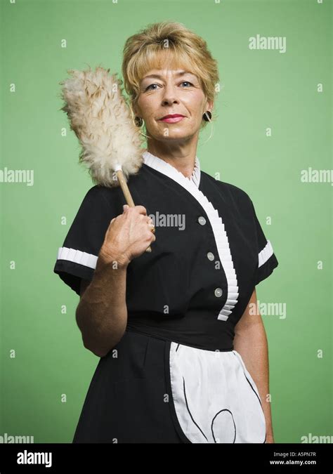 Female Housekeeper With Feather Duster Stock Photo Alamy