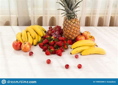 Delicious Fresh Fruits On A White Background And Sun Pineapple
