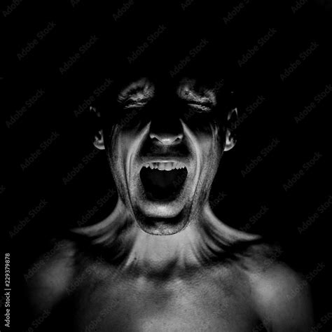 Stylish Dark Portrait Of Screaming Adult Caucasian Man Fear Concept Black And White Shot Low