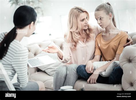 Attractive Mom And Daughter Sharing Problems With Psychologist Stock