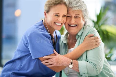 Youre In Good Hands With Her Portrait Of A Smiling Caregiver And A Senior Woman In A Wheelchair