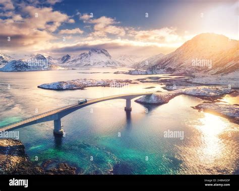 Aerial View Of Bridge Sea And Snowy Mountains In Lofoten Islands