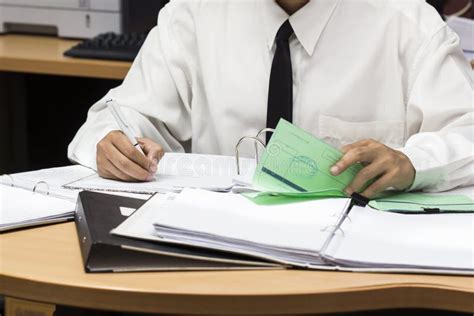 Businessman Writing Paper In File Stock Photo Image Of Looking