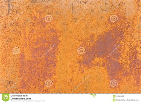 Textured Background Of A Faded Yellow Paint With Rusted Cracks On
