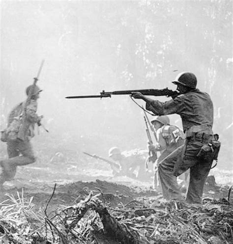 an infantrymen of the 129th infantry regiment 37th infantry division fires his m1 garand on