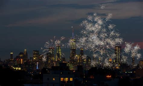 Firework Over City At Night With Fireworks Over Manhattan Stock Photo