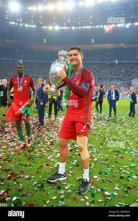 Portugals Cristiano Ronaldo Celebrates With The Trophy On The Pitch