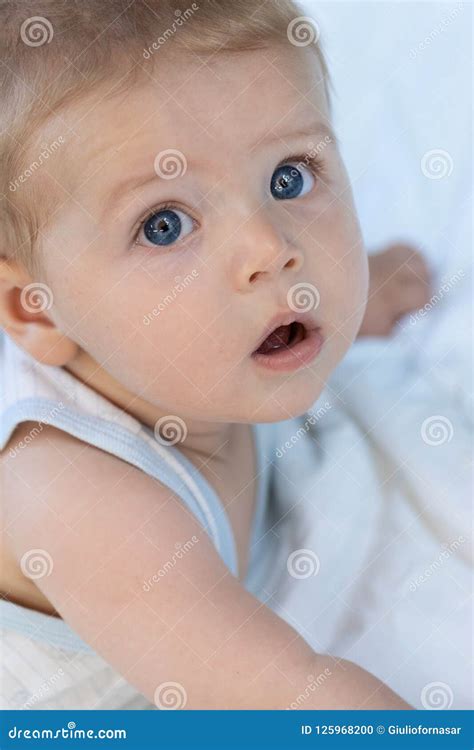 Thoughtful Calm Little Blue Eyed Baby Boy Stock Photo Image Of Gazing