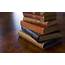 A Stack Of Old Books On Wooden Surface Wallpapers And Images 