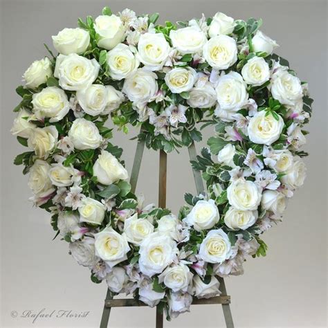 Heart Shaped Memorial Wreath With White Roses Is An Elegant Tribute