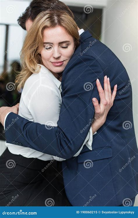 Passionate Couple Hugging And Having A Love Affair In The Office