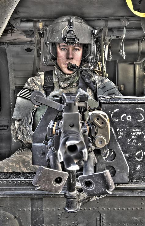 A Uh 60 Black Hawk Door Gunner Manning Photograph By Terry