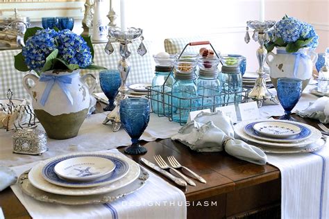 A Country French Table Setting With Blue And White Plates French