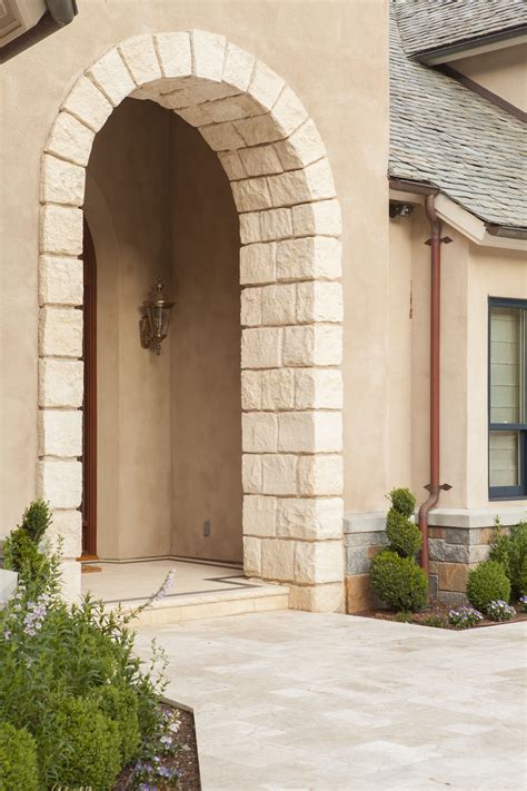 The Stone Arch Compliments The Travertine Entry Making For A Refined