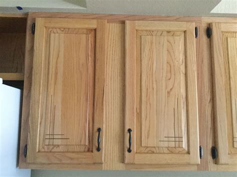 White painted cabinets with black tile backsplash. Refinished red oak cabinets with custom inlay. | Oak ...