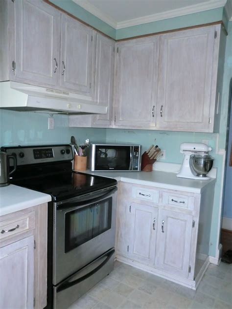 Cabinet paint bleached wood light grey stain diluted white. A Merry Heart: DIY White Washed Cabinets