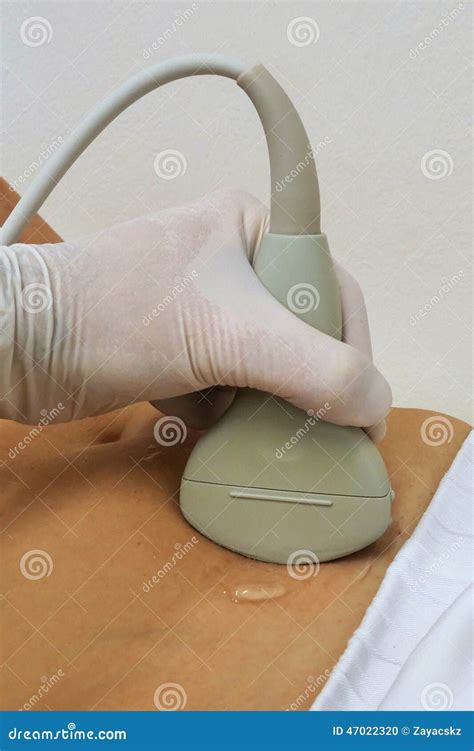 Abdominal Usg Convex Probe In Left Hand Scanning Female Stomach Royalty Free Stock Image