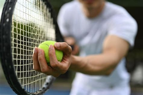 Premium Photo Closeup Shot Of Male Tennis Player Hand Holding Tennis