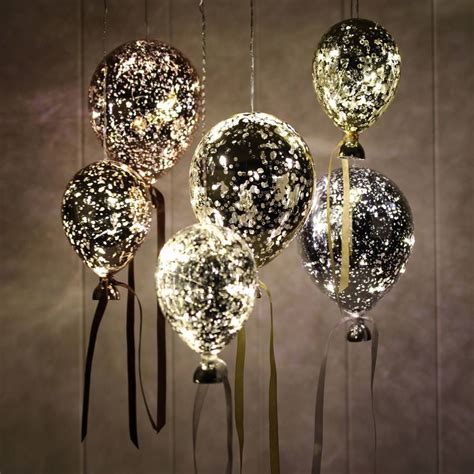 But don't forget to look up! hanging mirrored metallic balloon lights by nest ...