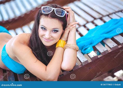 Woman Sunbathing In Bikini At Tropical Travel Resort Beautiful Young Woman Lying On Sun Lounger