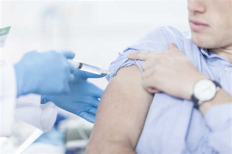 Doctor Giving Patient Injection Stock Photo