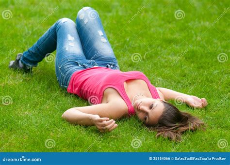 Beautiful Girl Lying On The Grass Stock Photo Image Of Denim