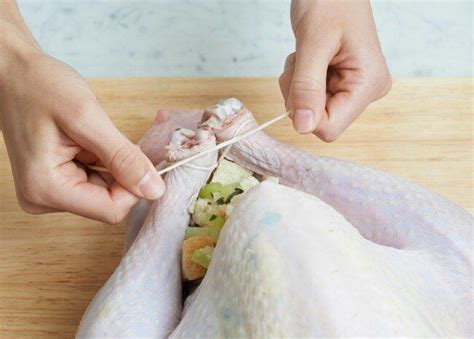 How To Truss A Turkey Tie The Legs Turkey Dinner Thanksgiving Turkey Thanksgiving Recipes