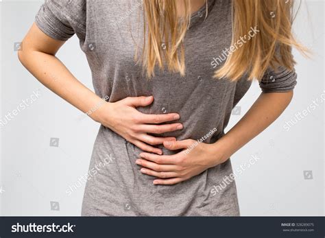 Young Woman Holding Her Stomach She Stock Photo 328289075 Shutterstock