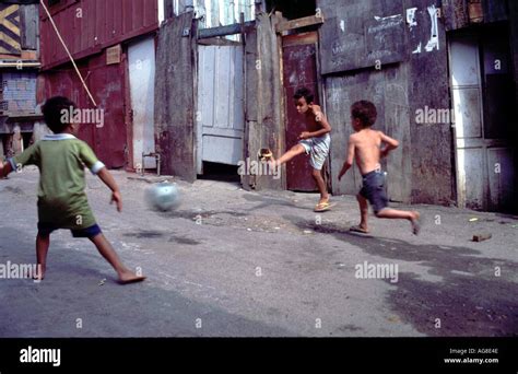 Brazil Children Playing Football In The Shanty Towns Of Santos Photo