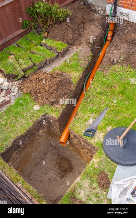 Digging A Drain Soakaway In A Small Front Garden Stock Photo Alamy