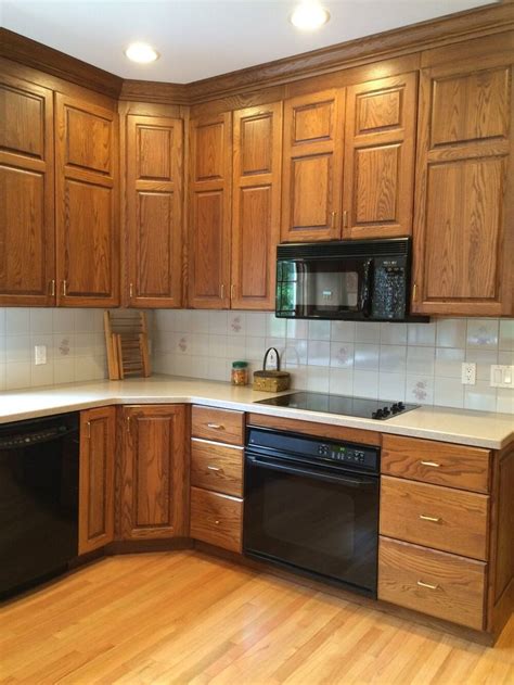 Akin to golden oak, maple, oak and pecan colonial.there are. Oak Cabinets with Black Hardware 2020 in 2020 | Oak ...
