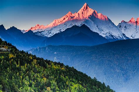 Sunrise Over Mianzimu Peak Meili Snow Mountain Photograph