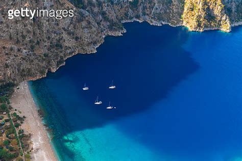 The Butterfly Valley Kelebekler Vadisi With Sandy Beach And Yachts In
