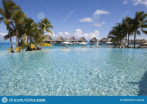 French Polynesia Over Water Bungalows Sandy Beach With Palm Trees And