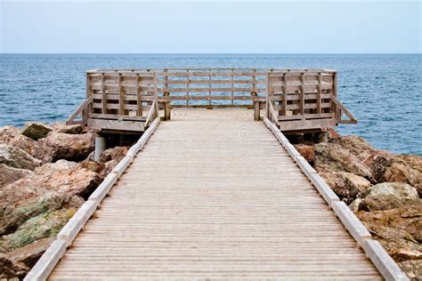 Long Wooden Dock With Observatory And View Of The Ocean Stock Image