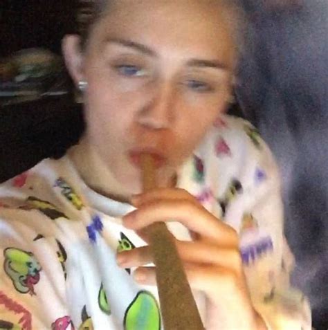 Miley Cyrus Posts Videos Of Herself Dancing Puffing On A Giant Cigar