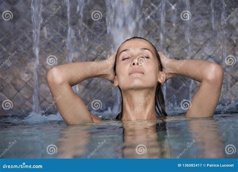 Woman In A Pool Under Waterfalls Stock Image Image Of Serenity Pool