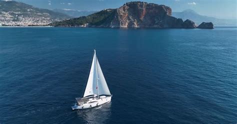 Sailboat Floating On Rippling Blue Sea Aerial View Vehicles Stock