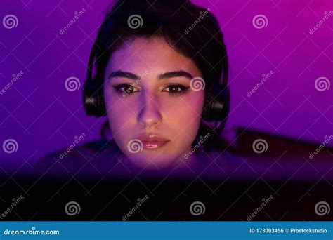 Millennial Girl Gamer Playing Videogame On Pc Indoor At Night Stock