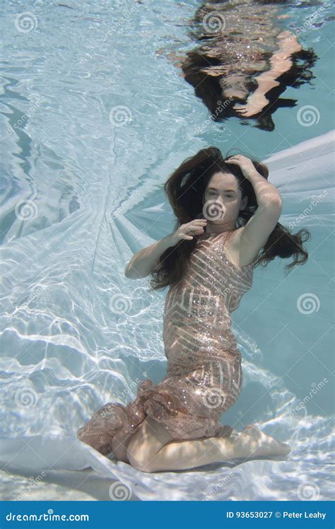 Woman Wearing A Gown Holding Her Breathe Underwater Stock Image Image Of Dappled Model 93653027