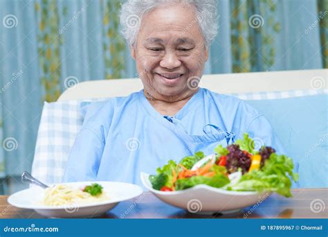 Asian Senior Or Elderly Old Lady Woman Patient Eating Breakfast