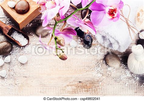Spa Setting With Pink Orchid Natural Soap Herbal Massage Ball And Essential Oil Wellness